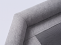 Close-up of the grey woven fabric bolster and mesh