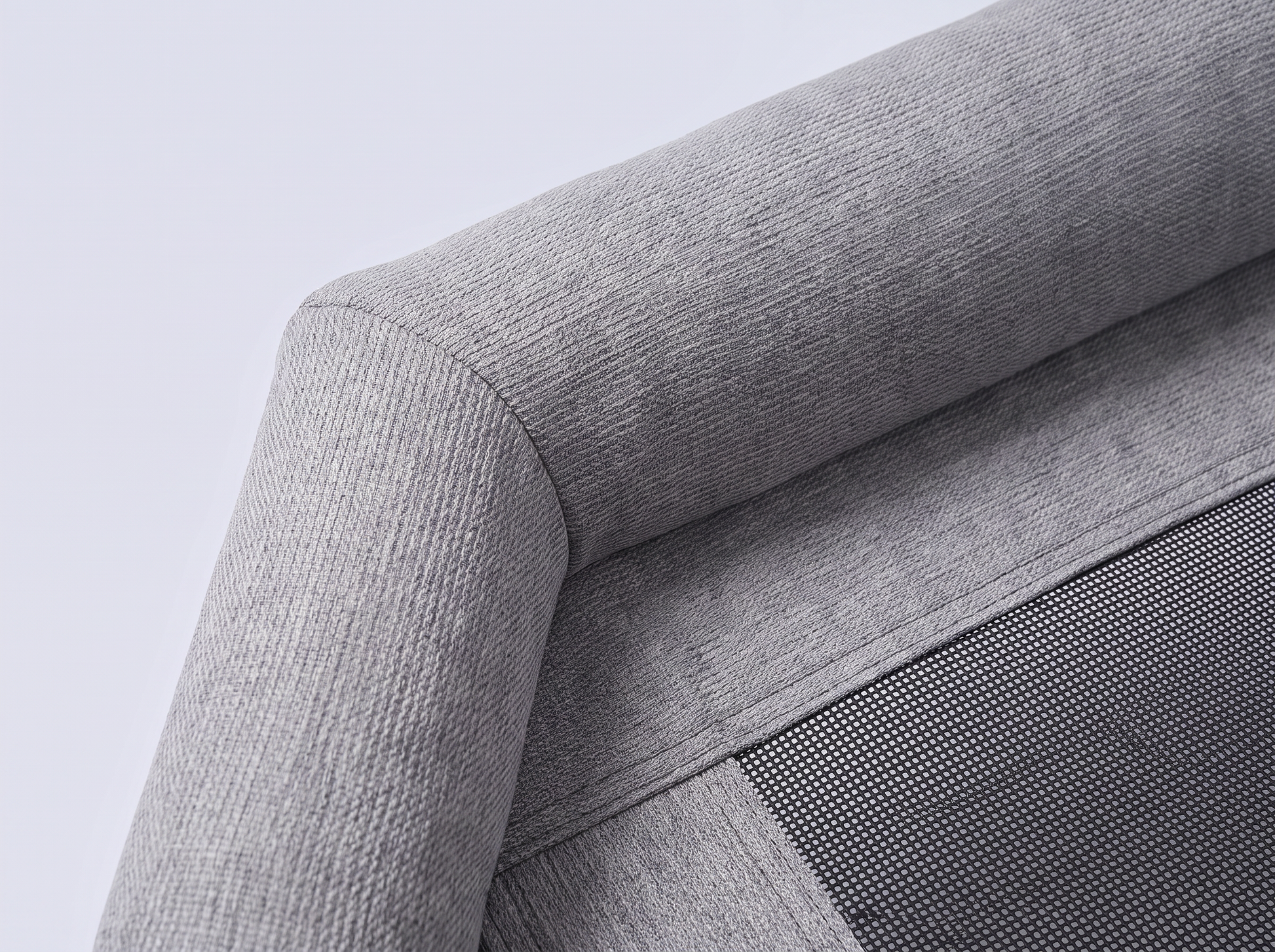 Close-up of the grey woven fabric bolster and mesh
