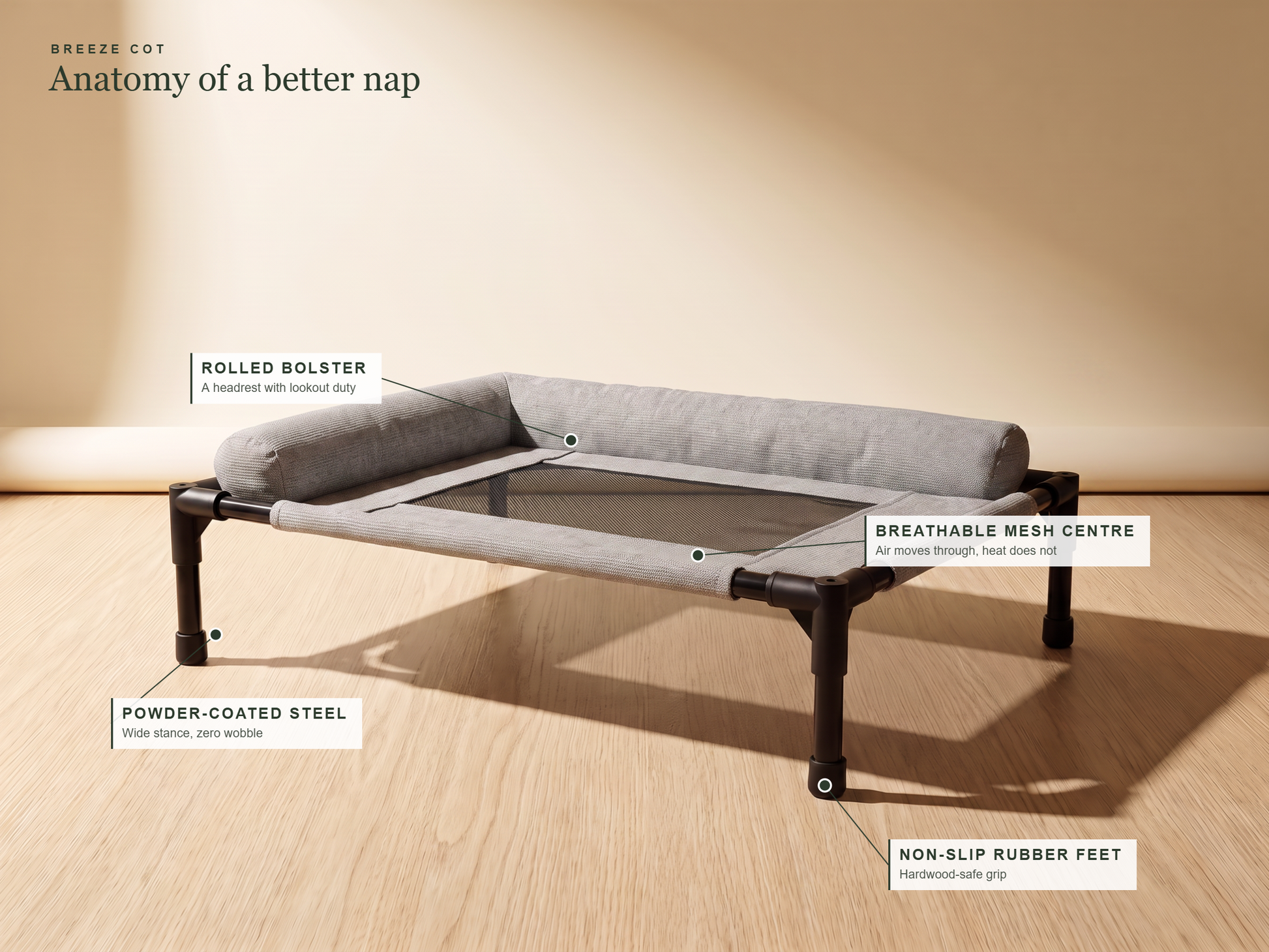 Breeze Cot grey — feature callouts: rolled bolster, breathable mesh, steel frame, non-slip feet